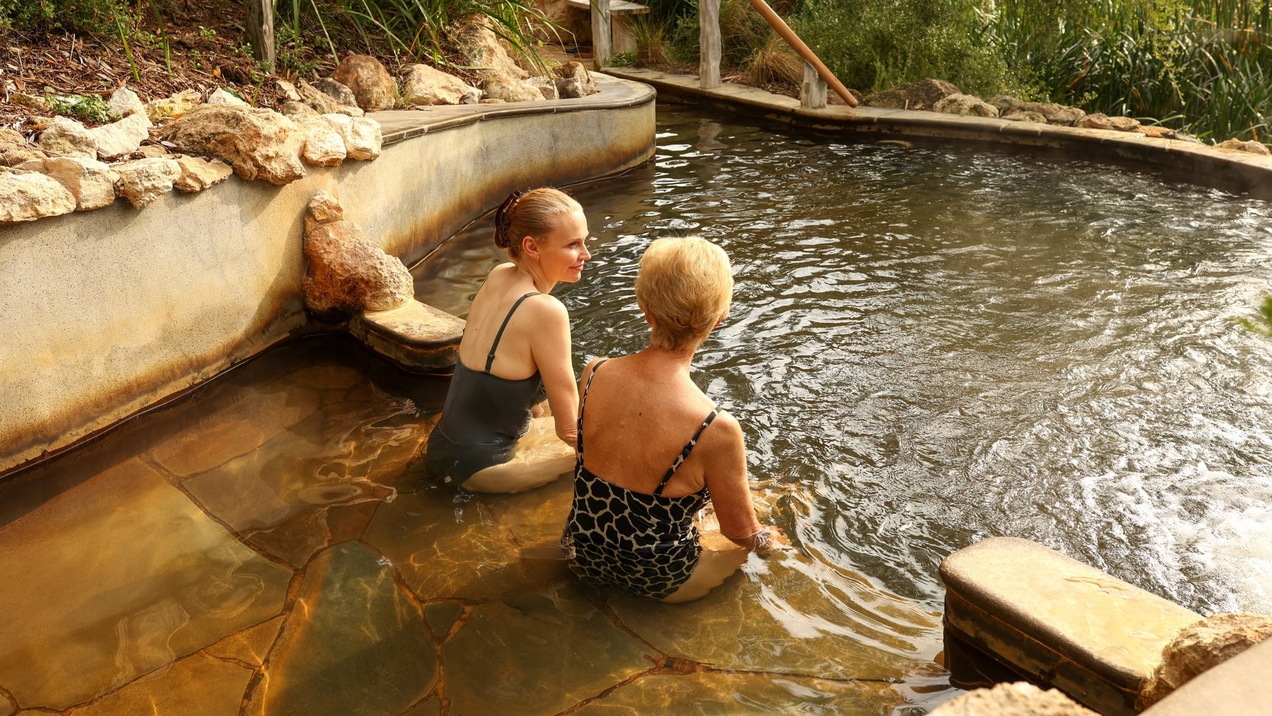 A mother and daughter bathing in hot springs