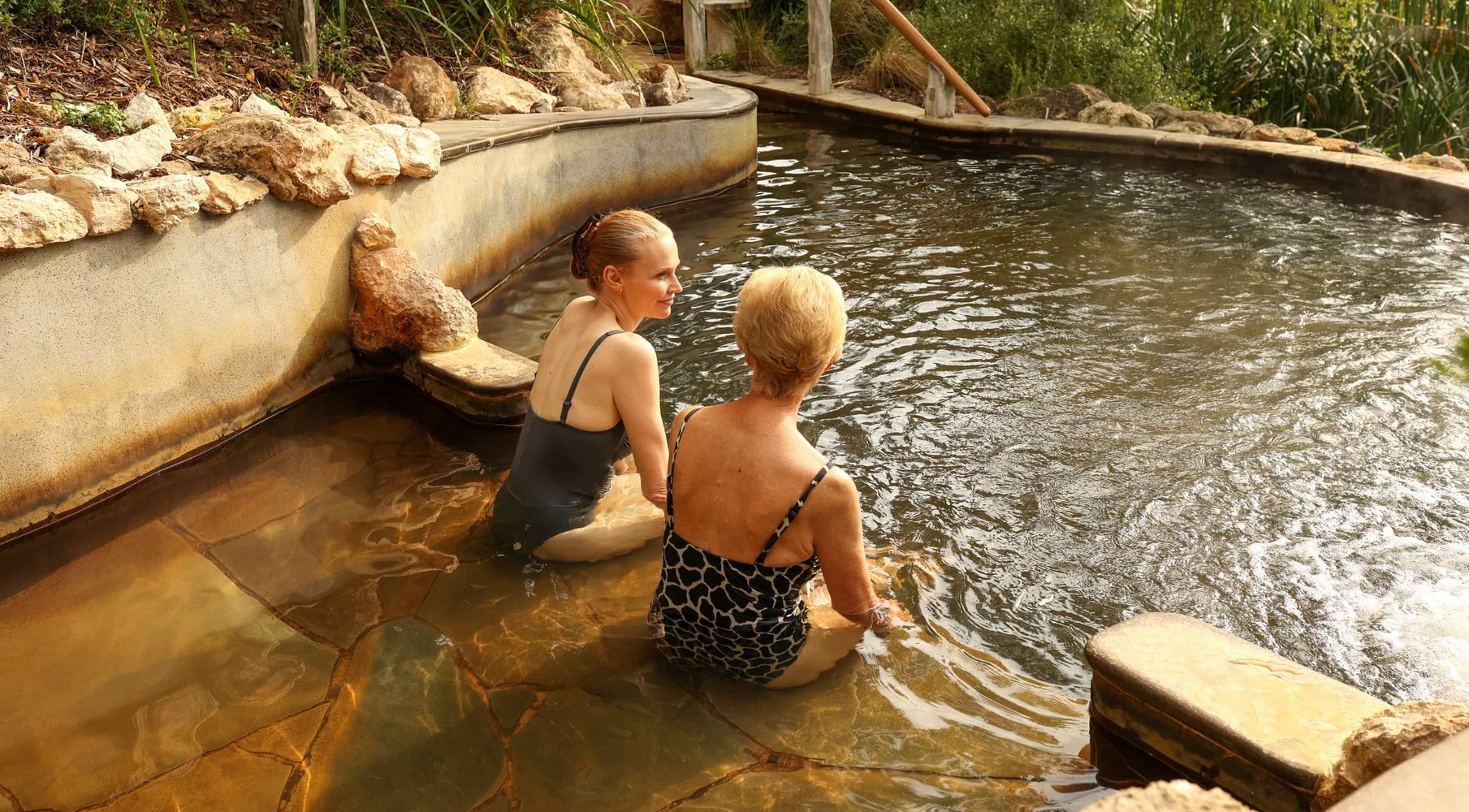A mother and daughter bathing inhot springs
