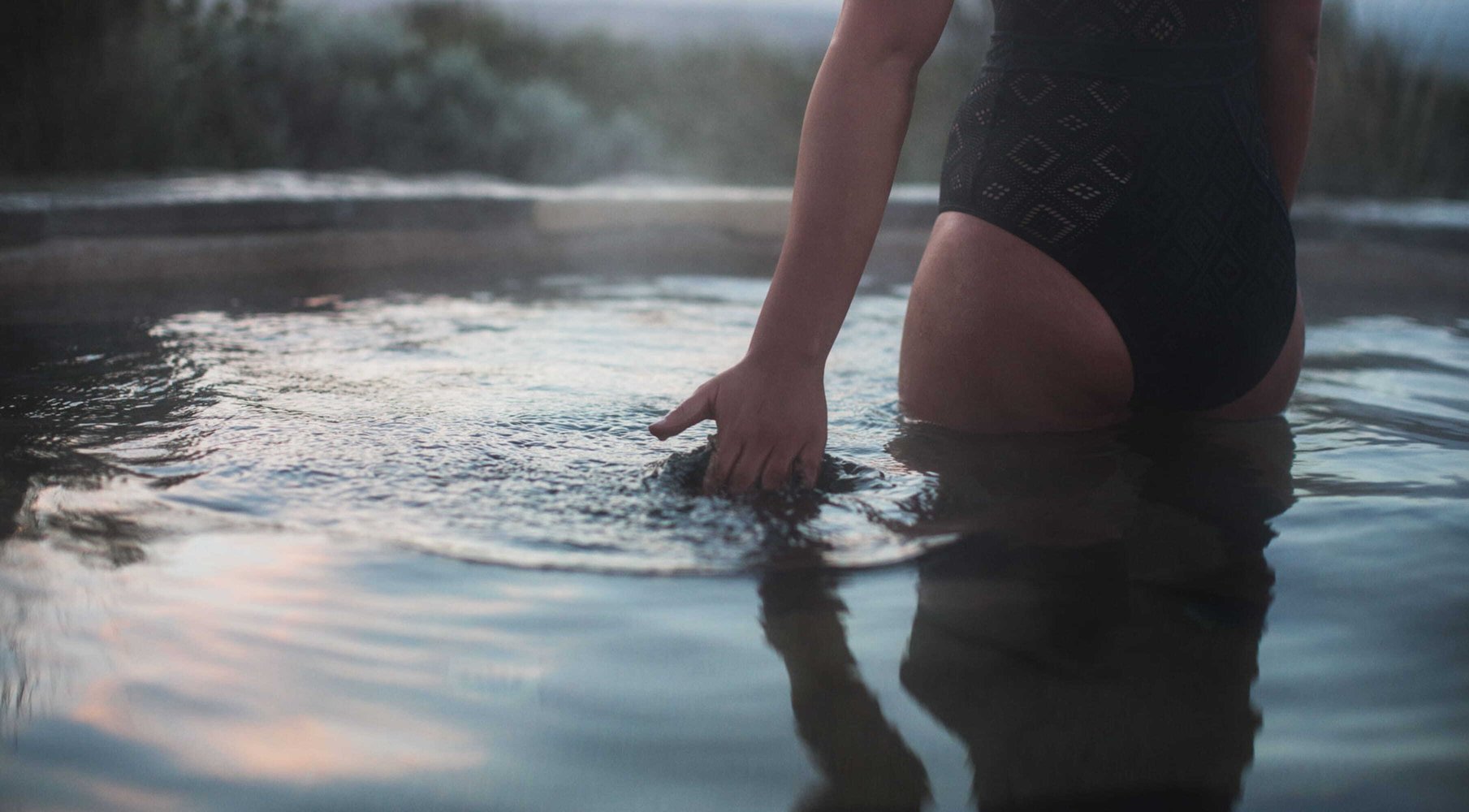 Someone moving their hand through water