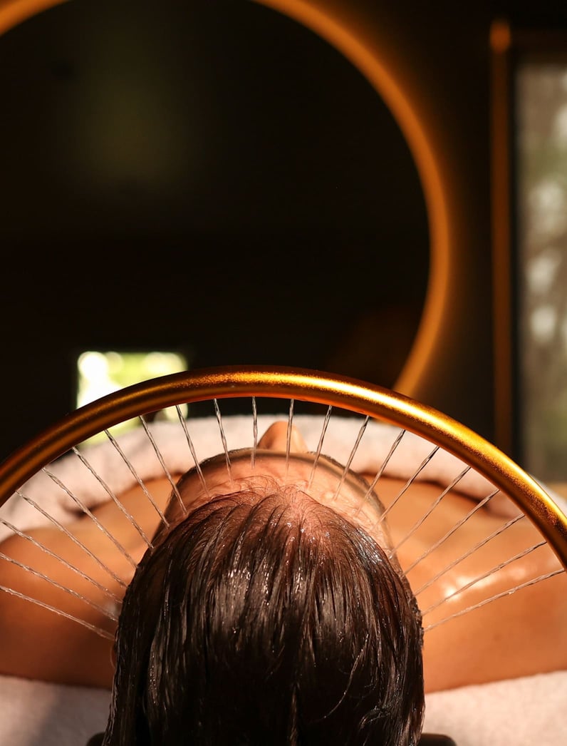 A woman receiving a Peninsula Head Spa treatment