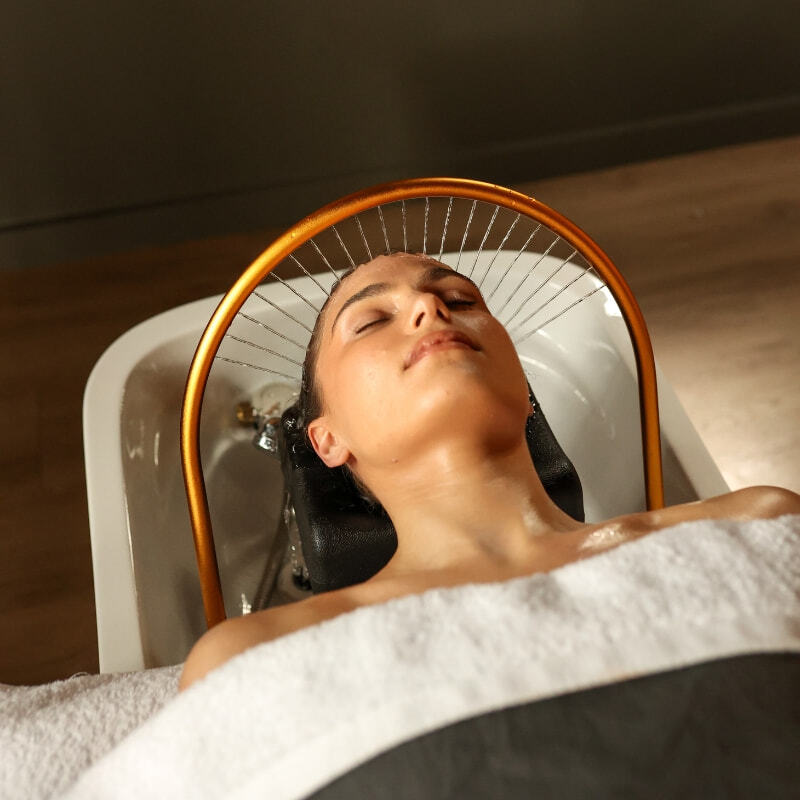 A woman having a Peninsula Head Spa treatment