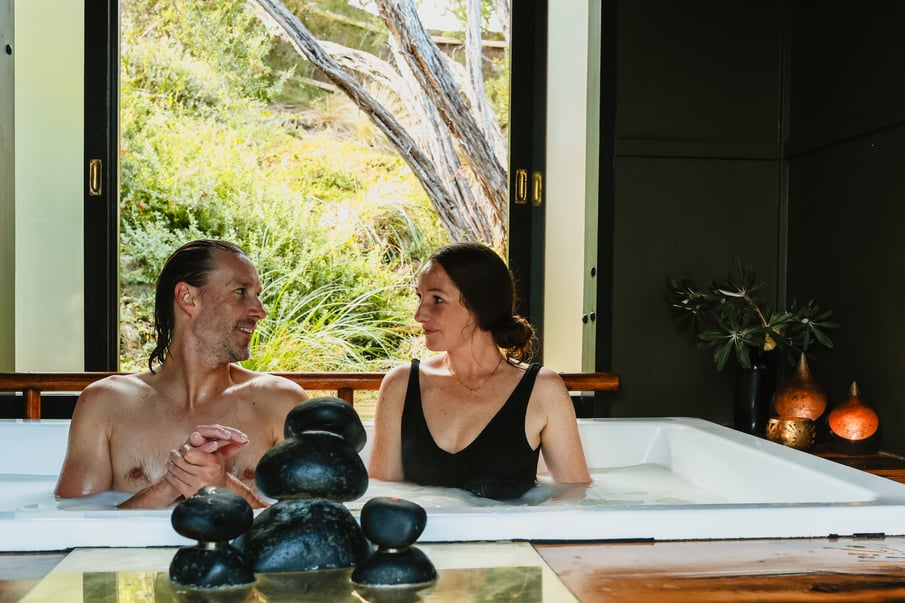 A couple bathing in a private indoor pool