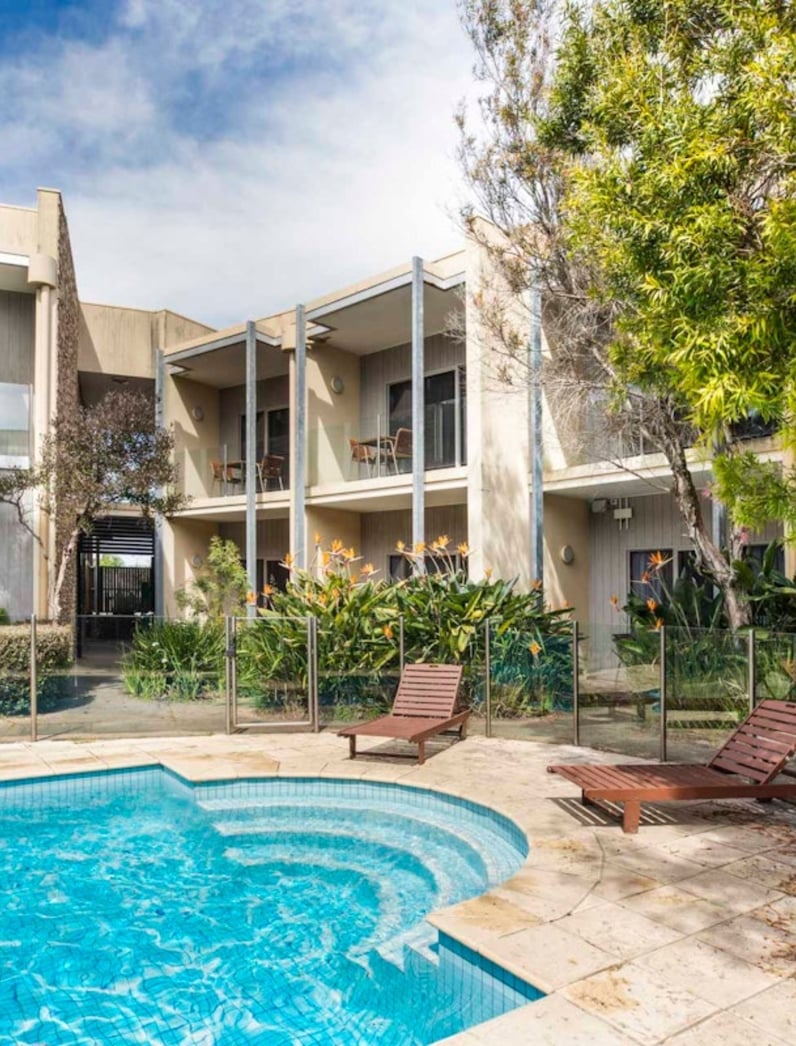 The exterior and pool at the Rye Hotel