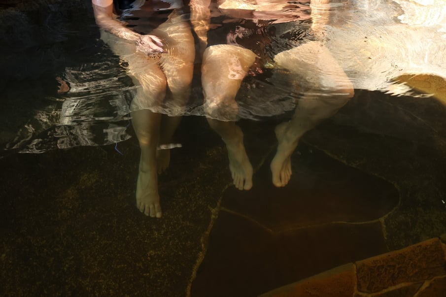 A couple bathing in geothermal springs