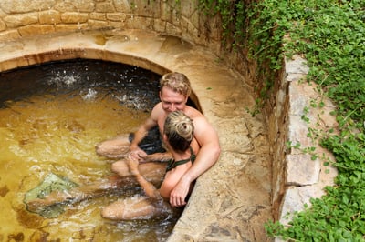 A couple bathing in hot springs