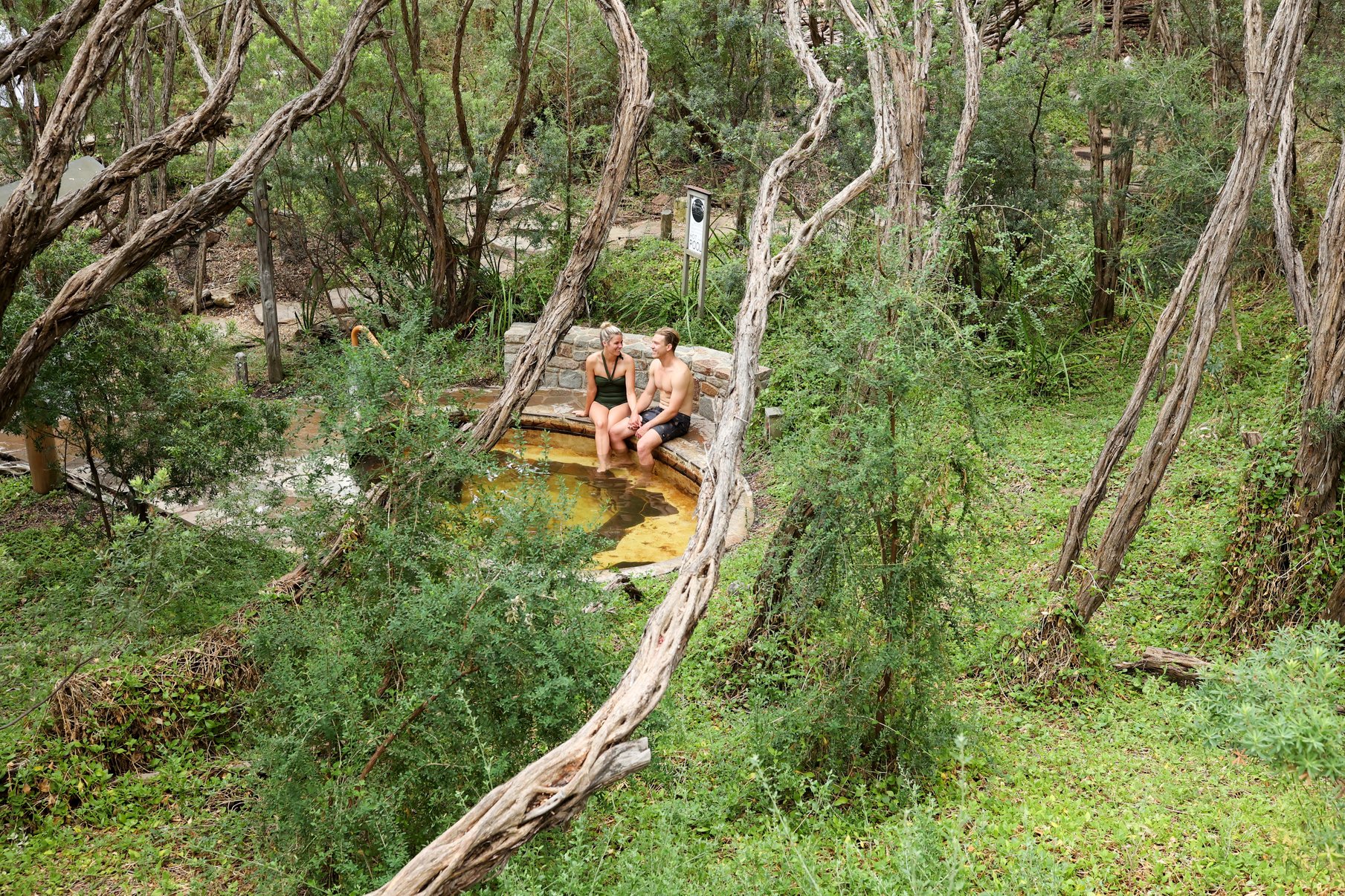 Two people bathing in nature