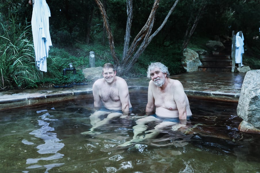 Two men bathing in hot springs