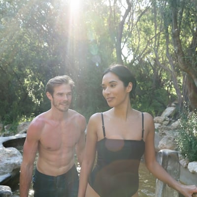 Two people walking out of a hot spring