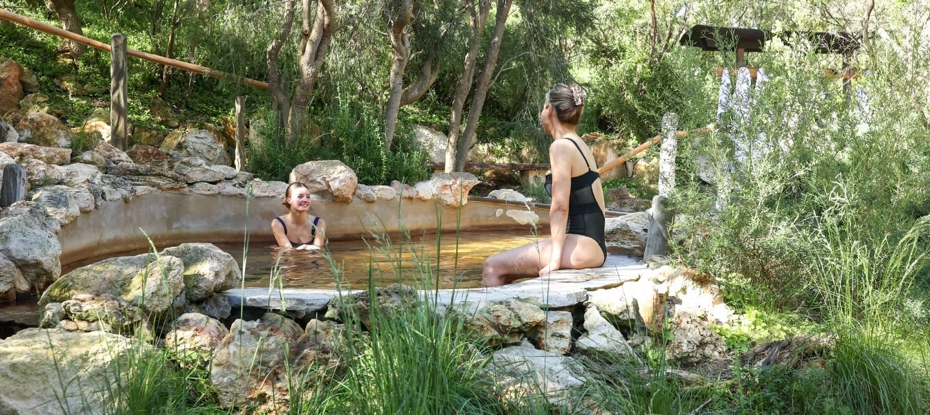 Two women bathing in hot springs