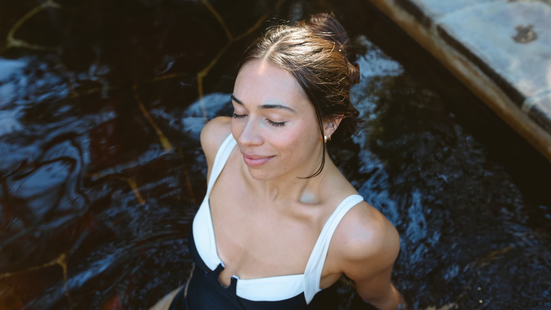 A woman bathing in hot springs