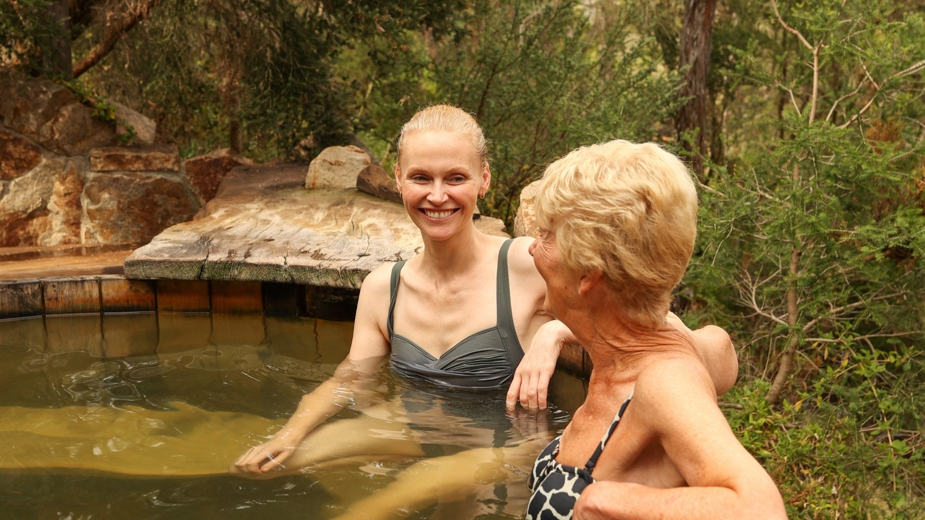 A mother and daughter bathing in hot springs