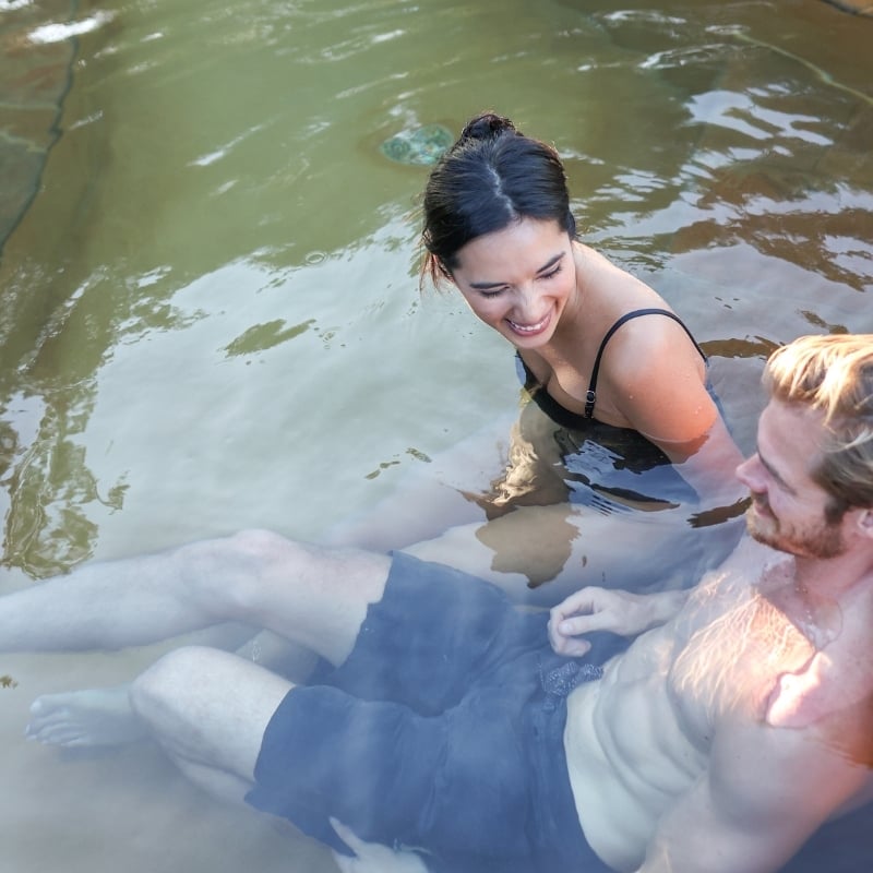 A couple bathing in hot springs