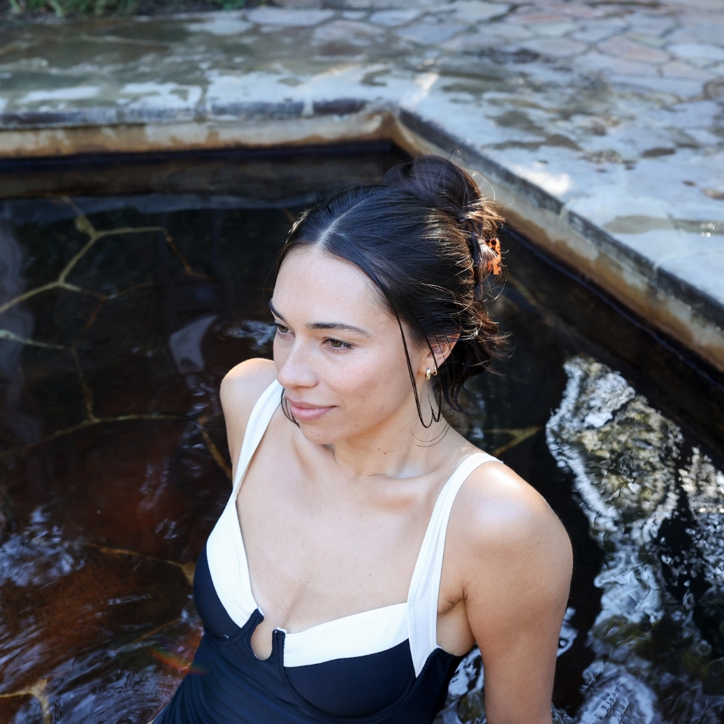 A young woman bathing in hot springs