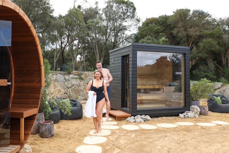 Two people walking from a sauna
