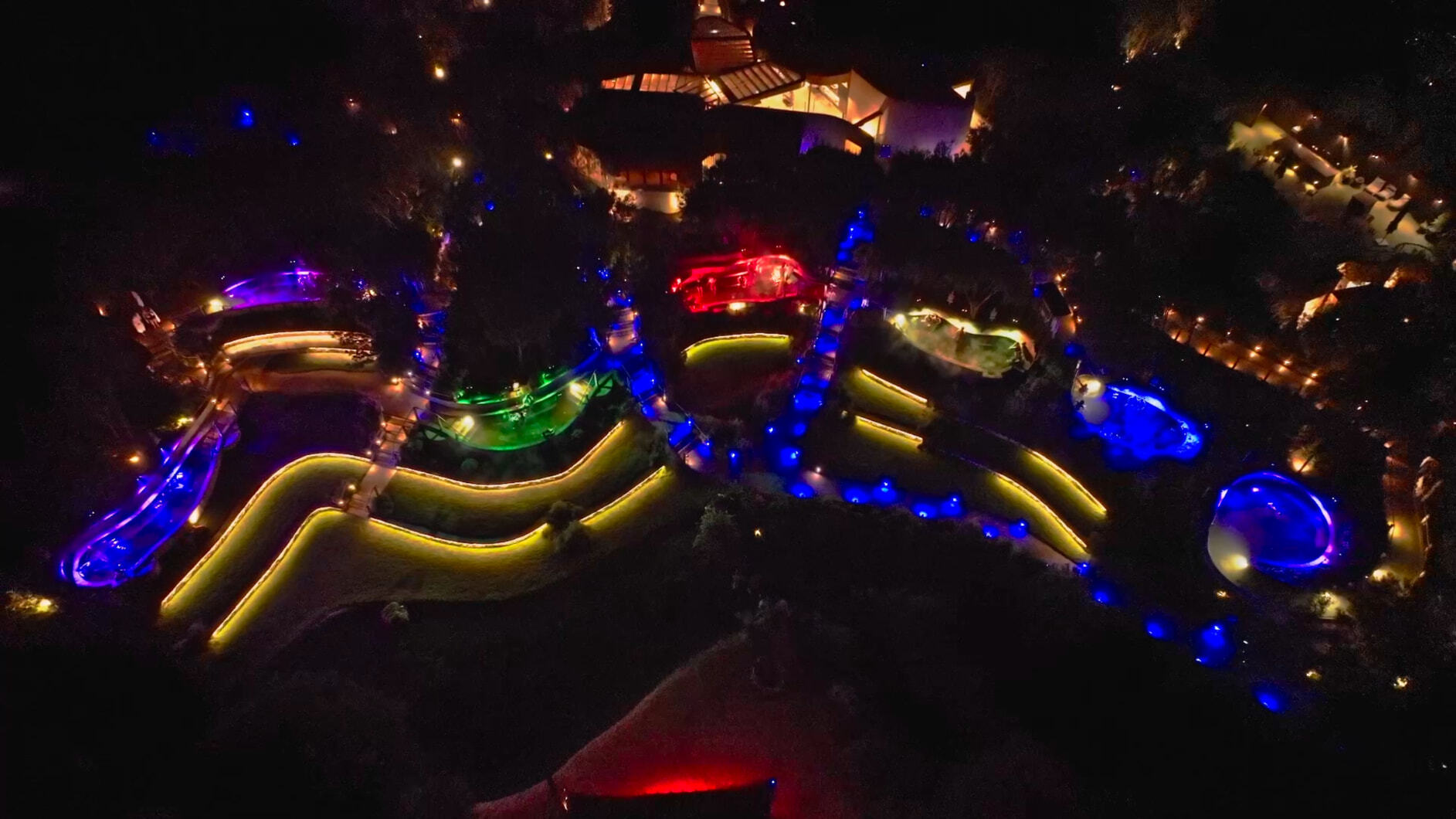 A drone shot of colourful hot spring pools