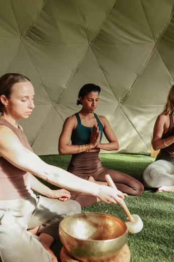 People doing Yoga in the Sound Dome