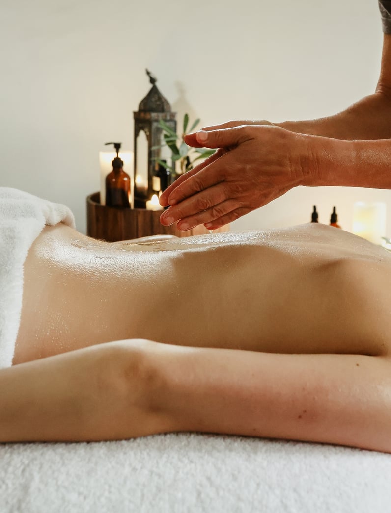 A woman receiving a back massage
