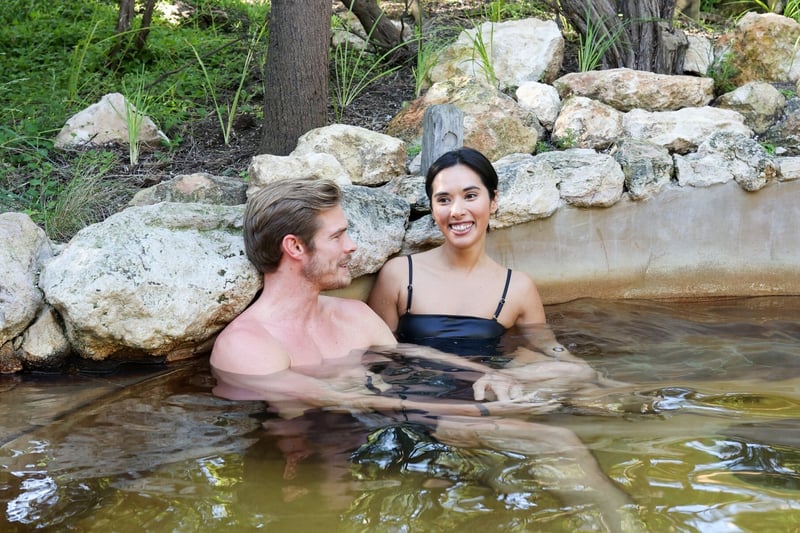 Two people bathing in hot springs
