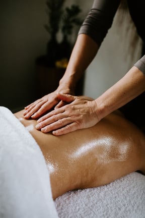 A person receiving a back massage