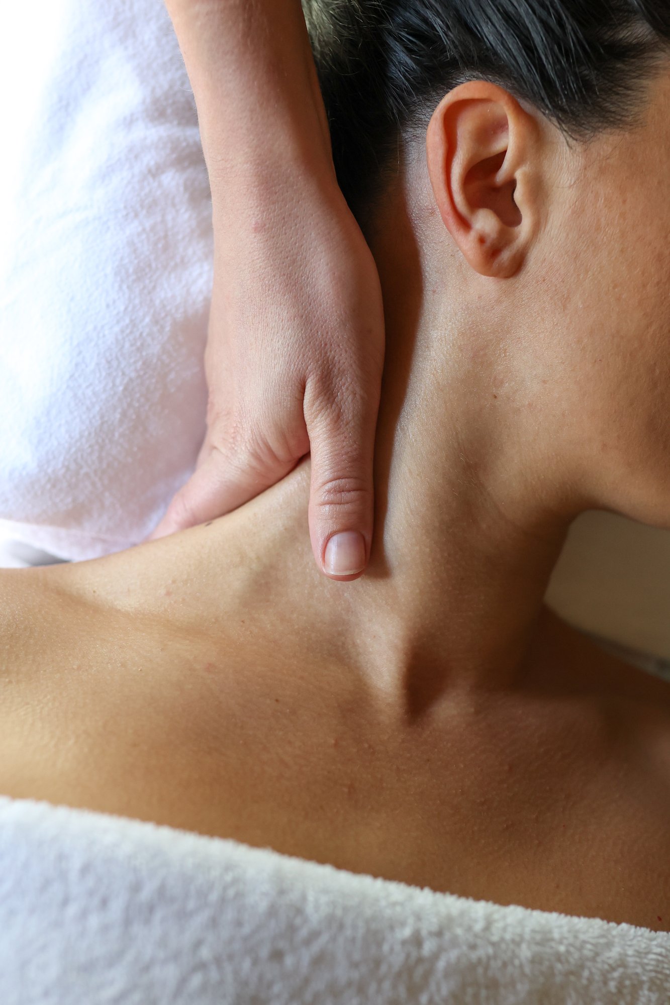 A woman receiving a neck massage