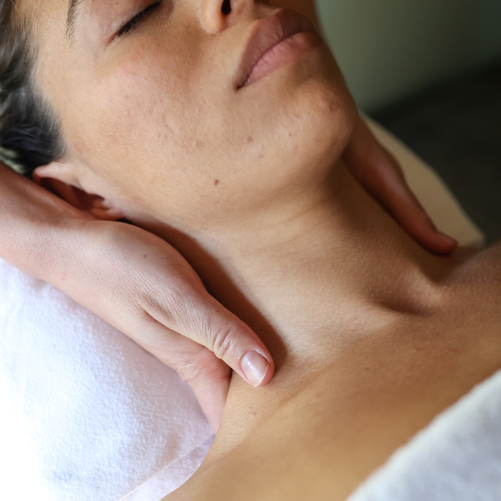 A person receiving a neck massage