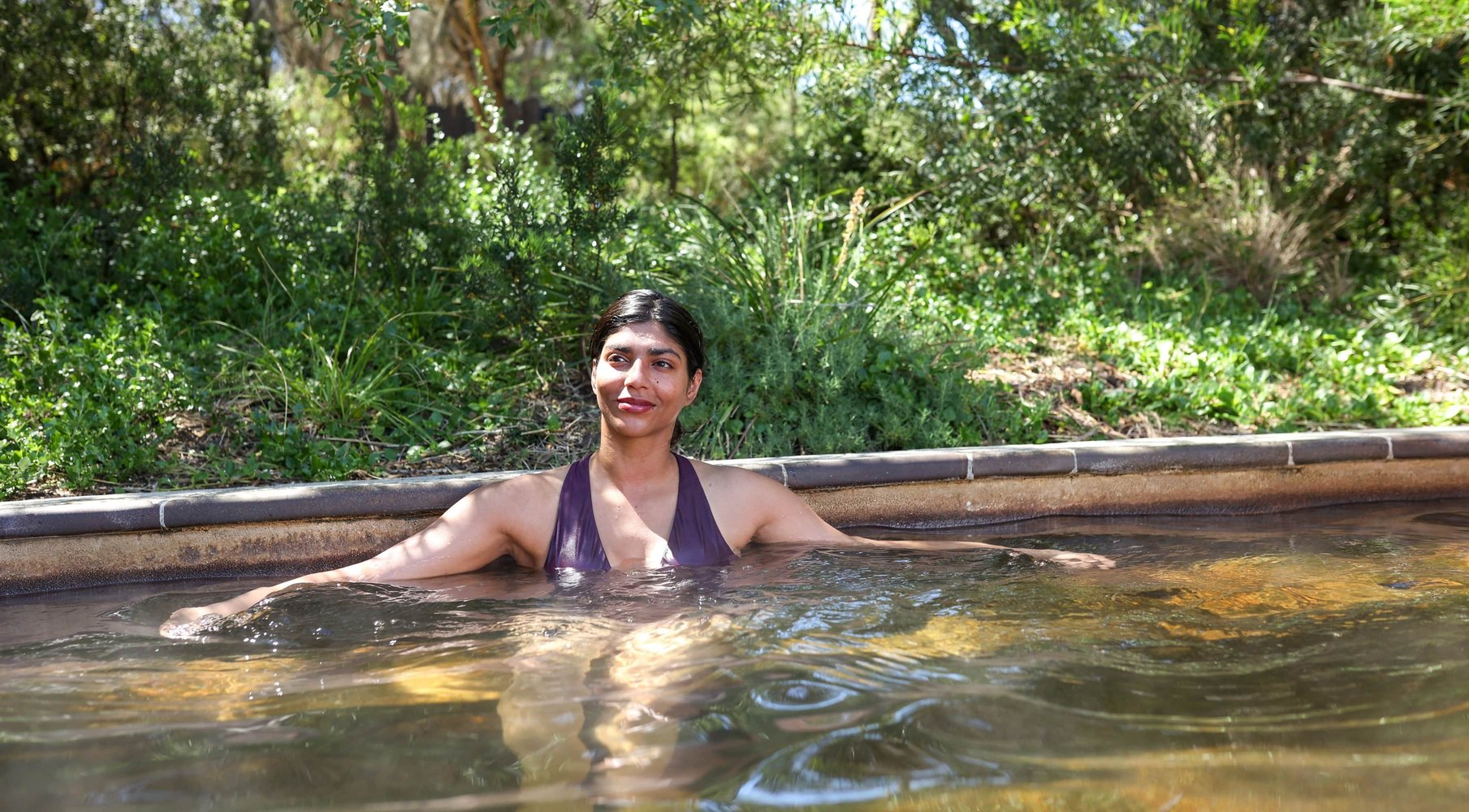 A woman bathing in hot springs