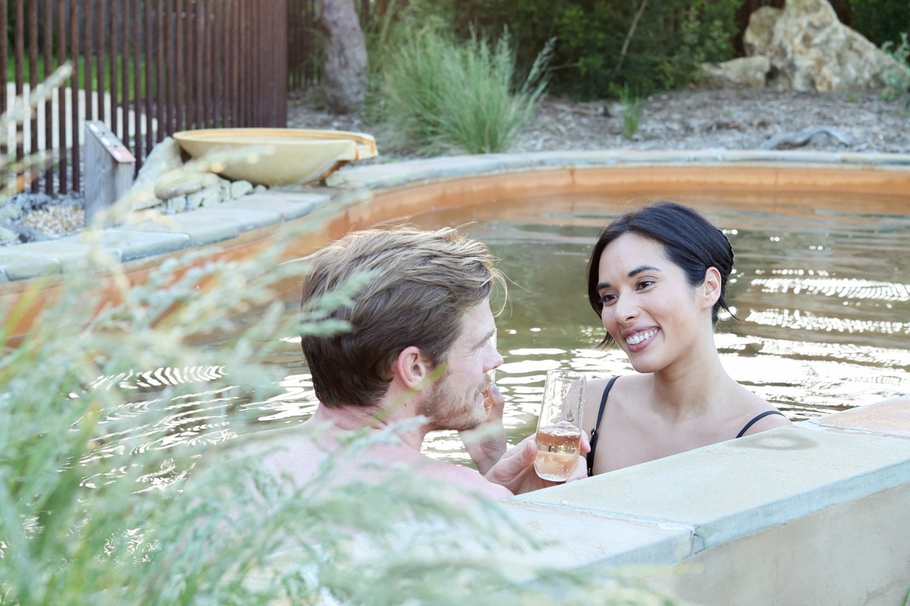 A couple bathing in the Eco Lodges private pool