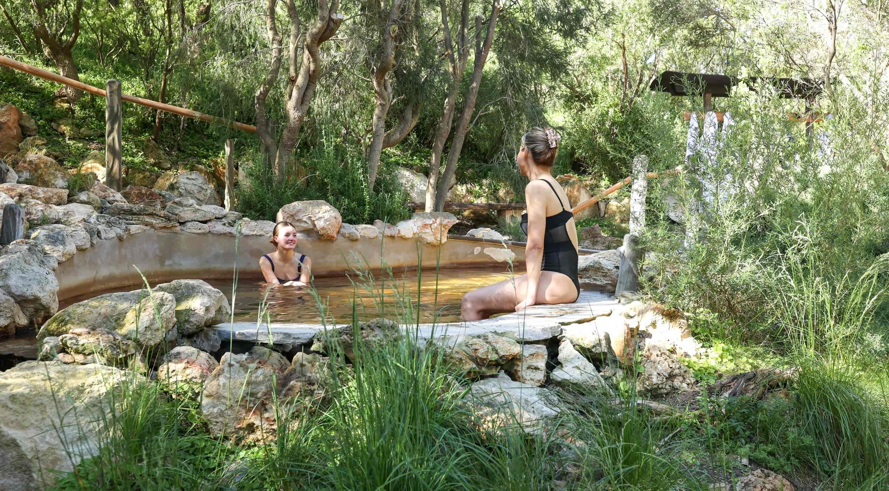 Two women bathing in hot springs