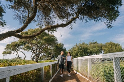 Two people walking on a path