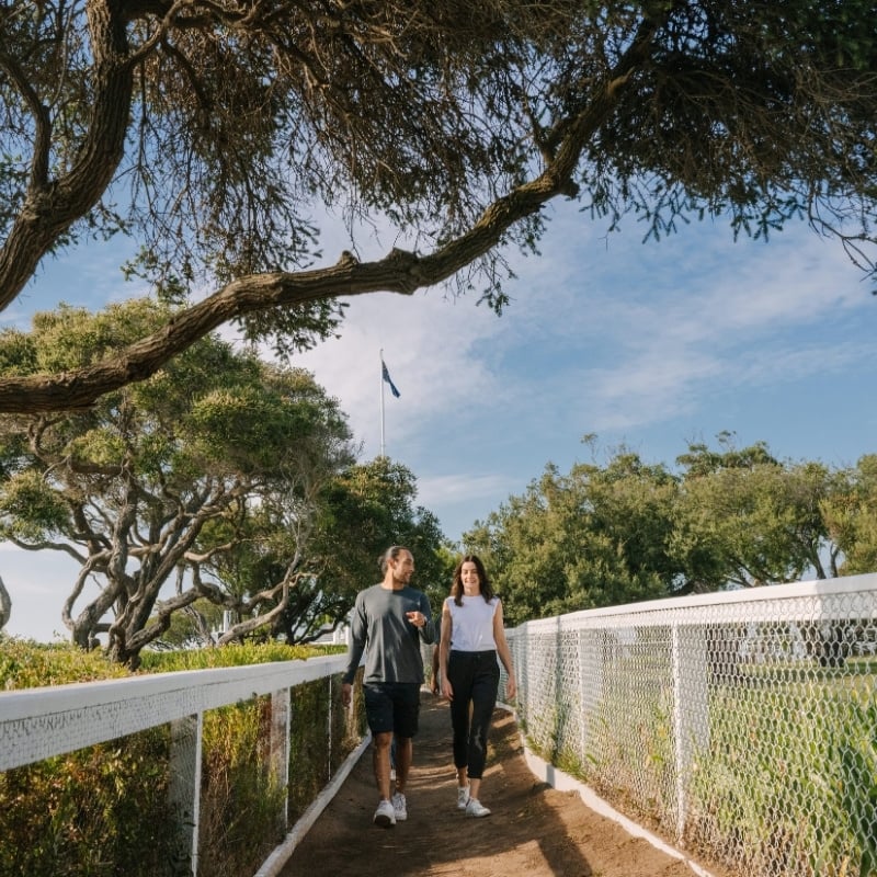 Two people walking on a path