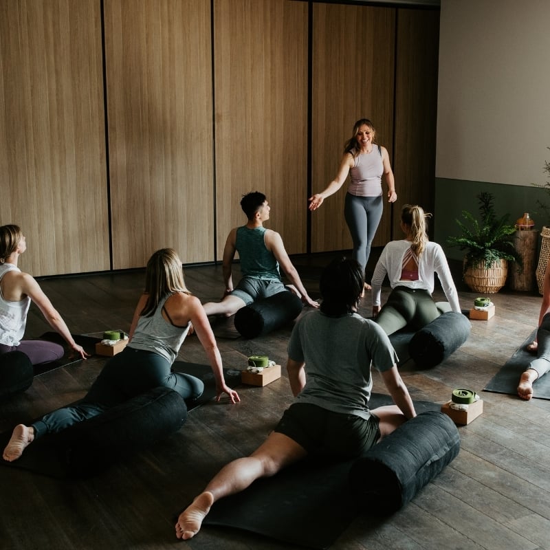A group doing a Yoga class