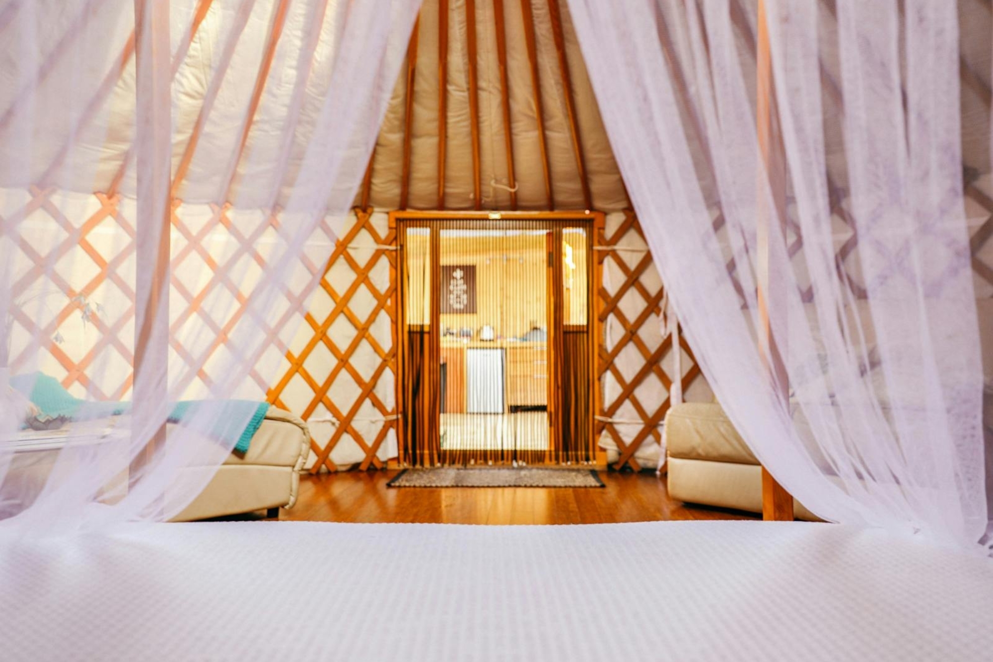 Curtains draping over a bed