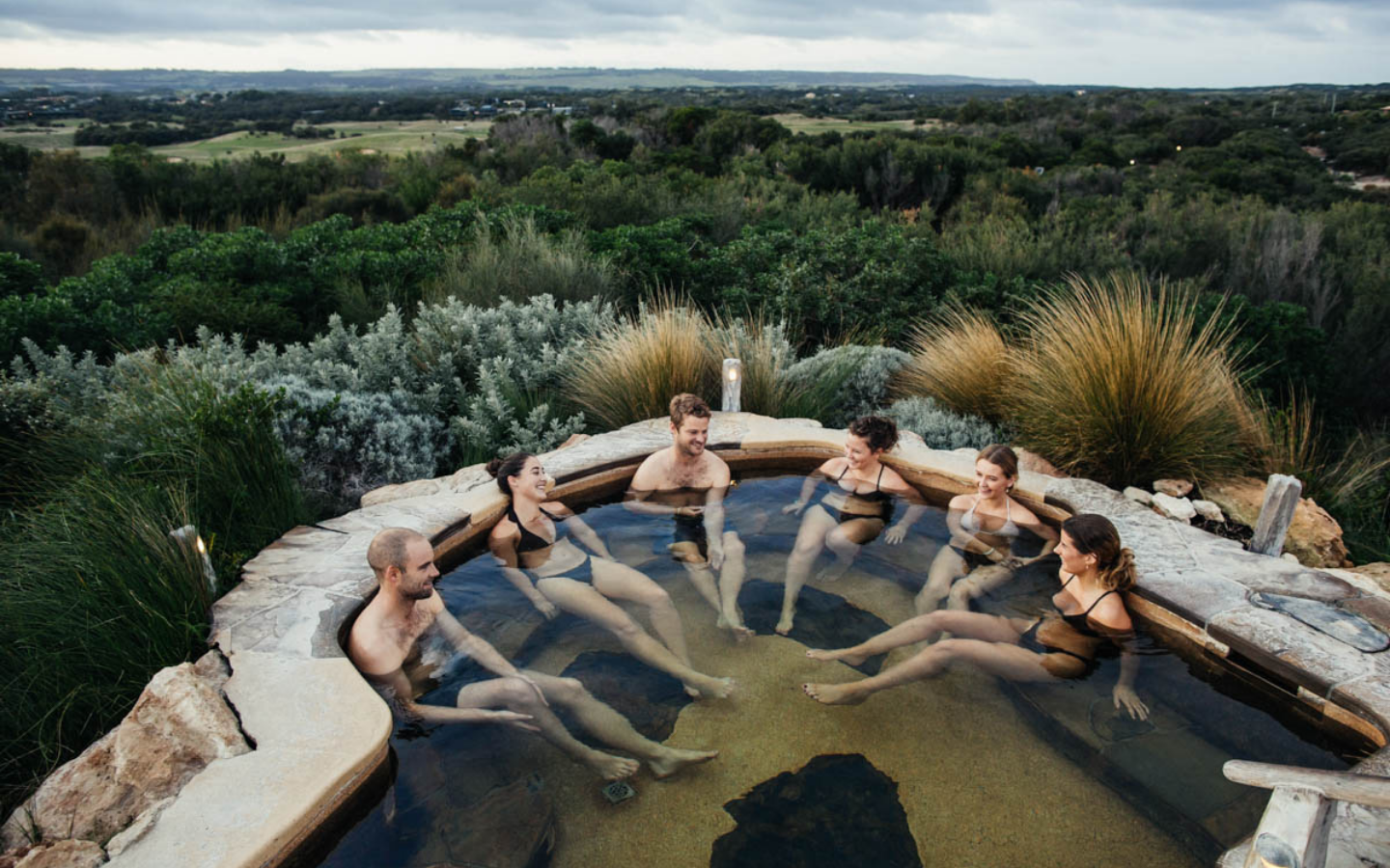 group-of-friends-enjoying-hilltop-pool.png